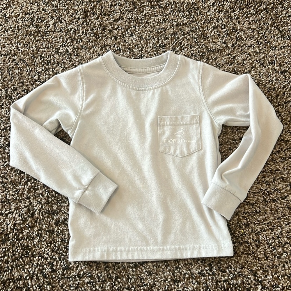 Properly tied boys long sleeve T-shirt.